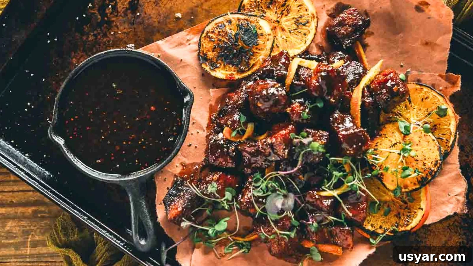 17 Potluck Appetizers to Get the Party Started 4 Smoked pork belly burnt ends glazed in maple chipotle bourbon sauce.