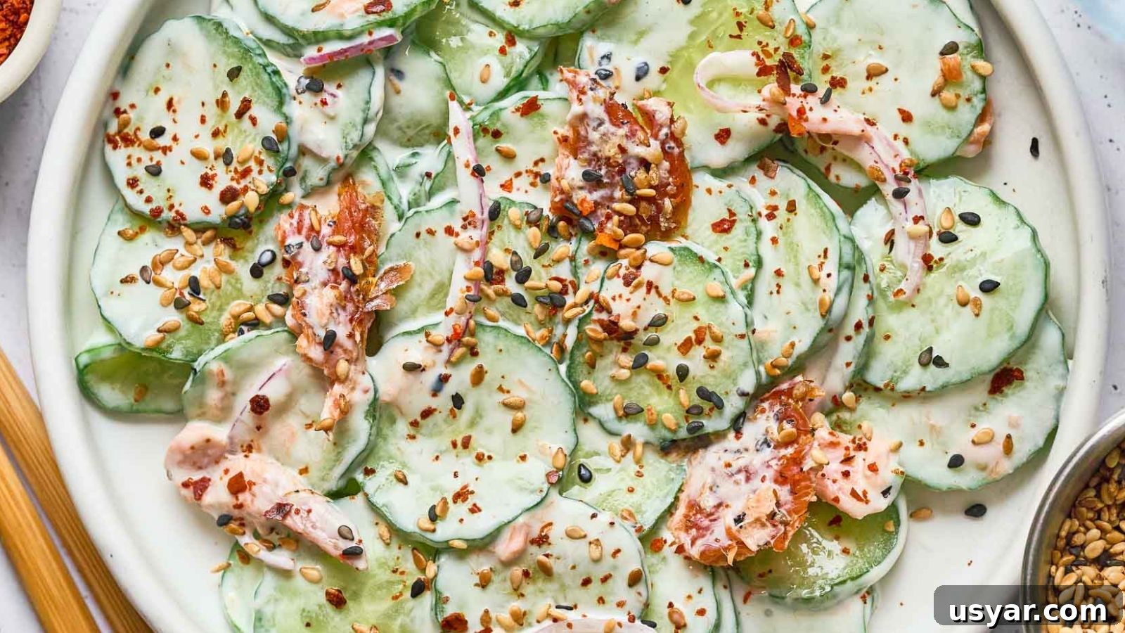 17 Potluck Appetizers to Get the Party Started 9 Philly roll cucumber salad with crab, cucumber, and savory toppings.