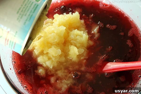 Old Fashioned Cranberry Salad with Pineapple and Pecans 12 Adding crushed pineapple to Jello mixture.