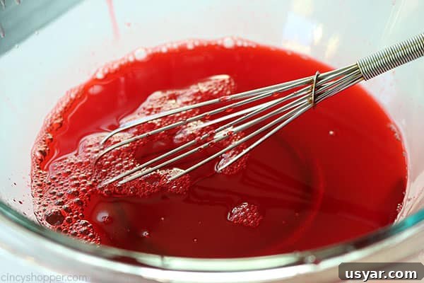 Old Fashioned Cranberry Salad with Pineapple and Pecans 10 Whisking to dissolve raspberry Jello.