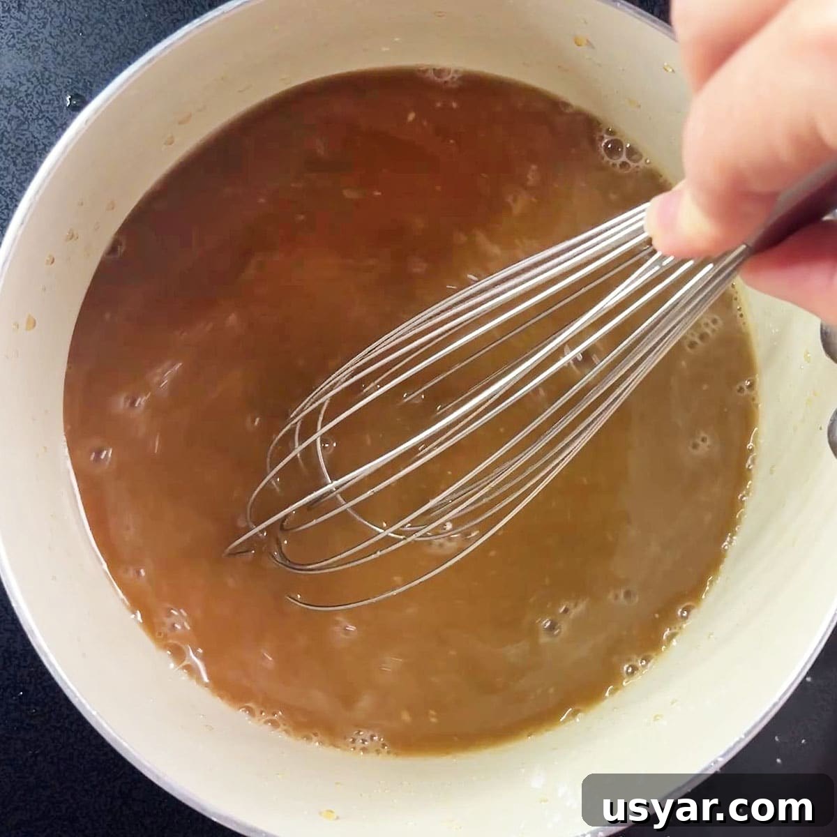 Coca Cola Glazed Ham Recipe 10 Whisking the cornstarch into the glaze for ham with coke.