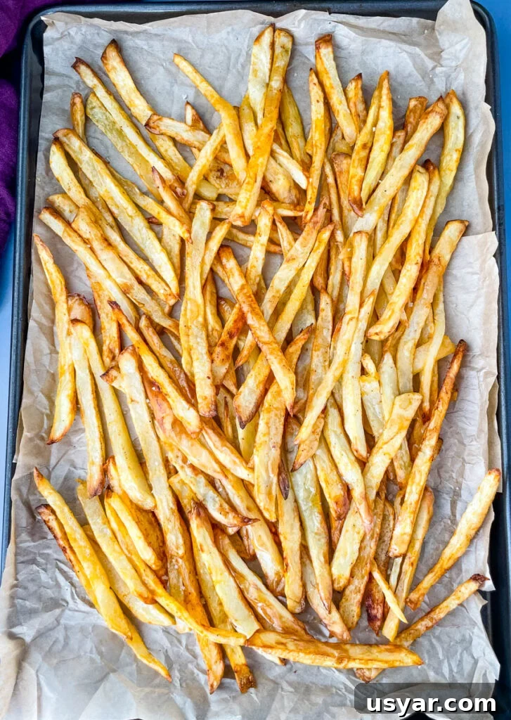 Crispy Homemade Air Fryer French Fries 7 cooked French fries on a sheet pan