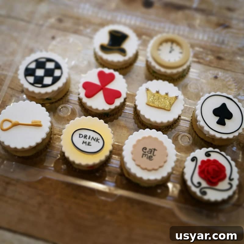 Custom Cakes for Weddings, Birthdays and Special Events 3 10 Alice in Wonderland cupcakes topped with a key, drink me, eat me and hear decor.