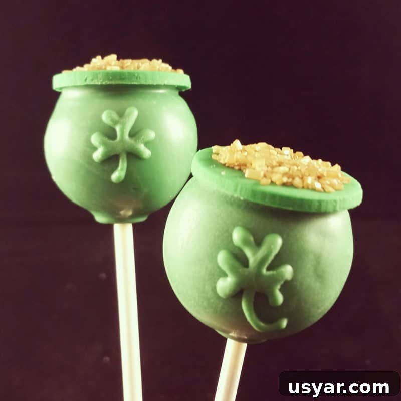 Custom Cakes for Weddings, Birthdays and Special Events 4 2 green pots of gold St. Patrick's Day Cake pops topped with gold glitter.