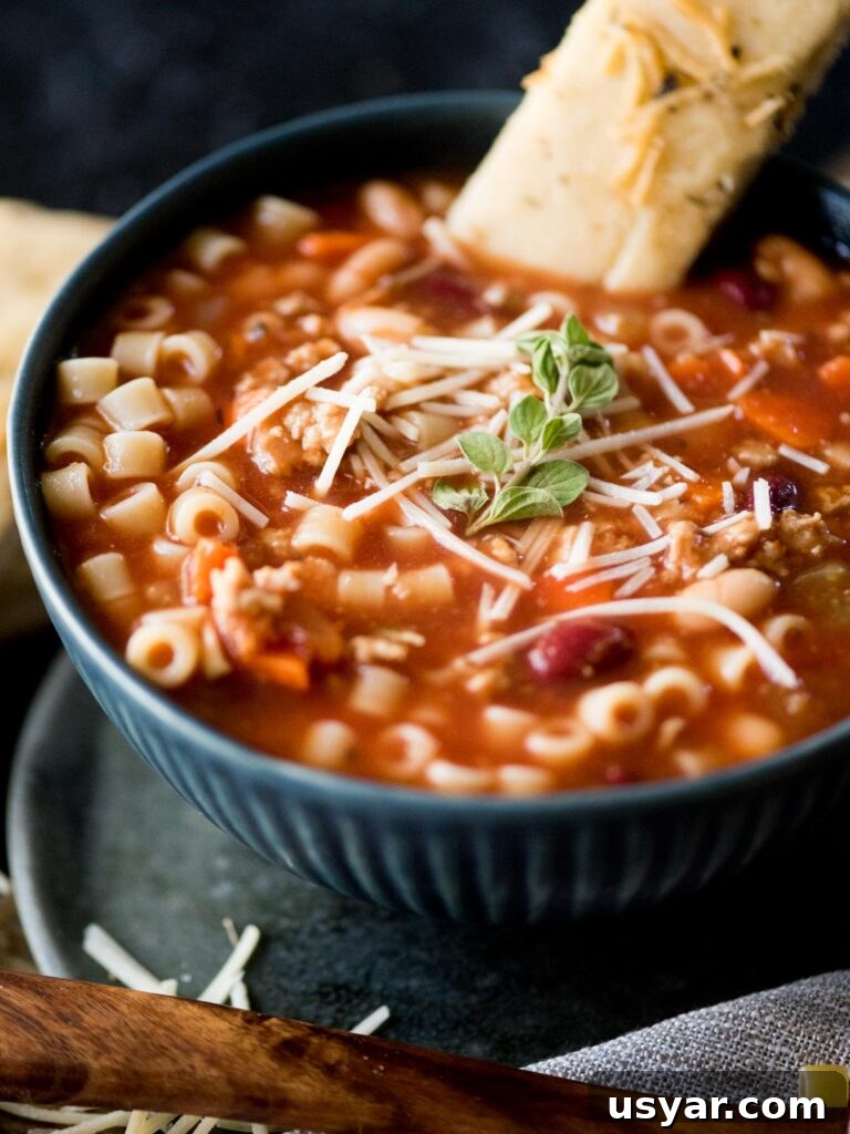 Authentic Italian Pasta e Fagioli Soup Recipe 15 pasta fagioli soup with a garlic parmesan breadstick, parmesan, and oregano