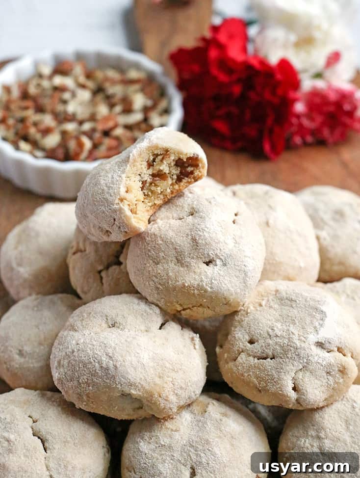Paleo Mexican Wedding Cookies Recipe 2 Paleo Mexican Wedding Cookies made with pecans and rolled in homemade powdered sugar.