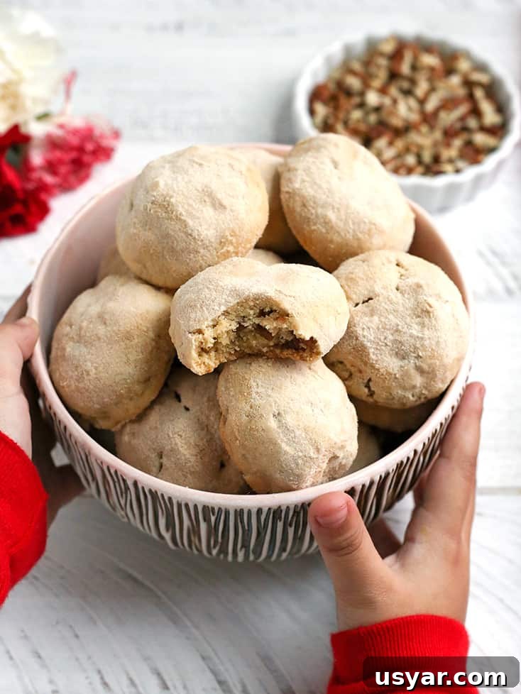 Paleo Mexican Wedding Cookies Recipe 5 Dairy free Paleo Mexican Wedding Cookies with pecans and powdered sugar coating.
