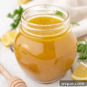 Close up view of a jar of salad dressing.