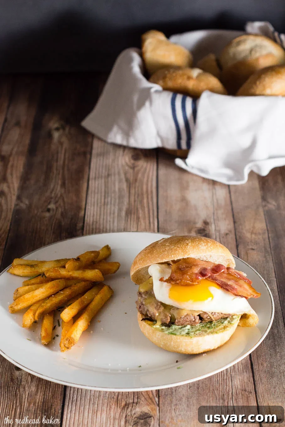 French Bistro Burgers with Gruyère and Dijon 3 French Bistro Burger stacked with Gouda cheese, bacon, herb aioli, and a sunny-side-up egg