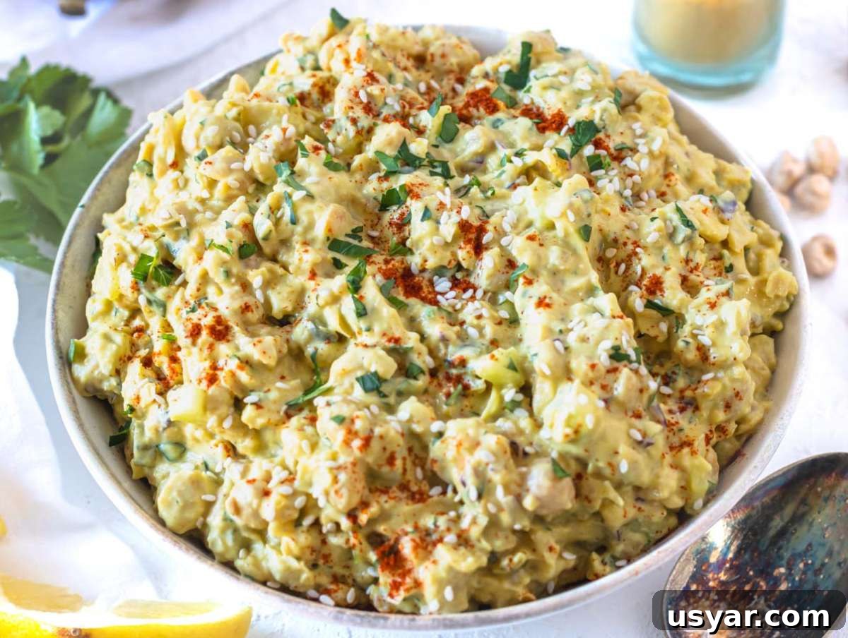 Creamy curry chickpea salad in a bowl.