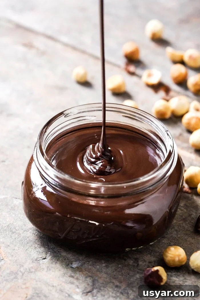 Pouring paleo and keto Nutella hazelnut spread