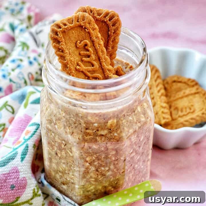 Creamy Biscoff Overnight Oats Recipe 13 Biscoff overnight oats in a jar with crumbled Biscoff cookies on top.