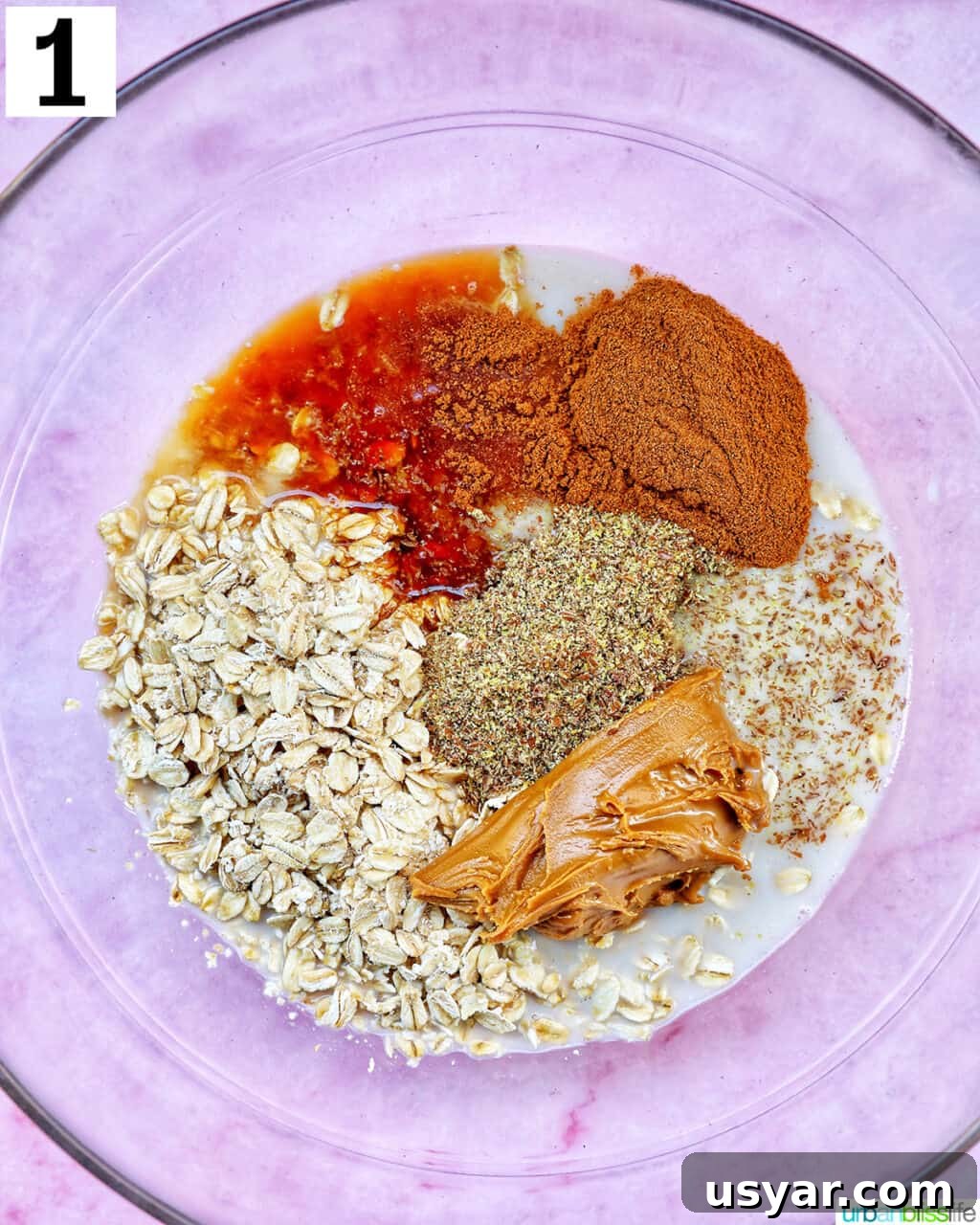 Creamy Biscoff Overnight Oats Recipe 5 ingredients to make Biscoff overnight oats in a large glass bowl.