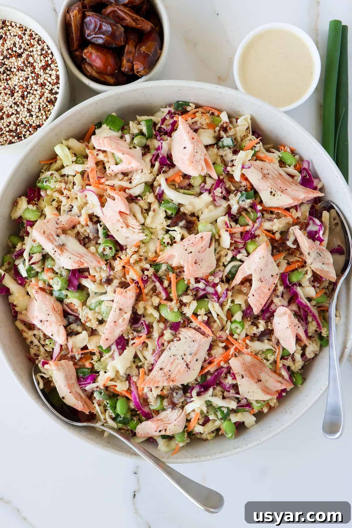 Smoked Trout and Edamame Salad with Lemon Dressing 7 Smoked trout salad in large serving bowl with spoons.