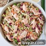 Smoked trout salad in large serving bowl with spoons.