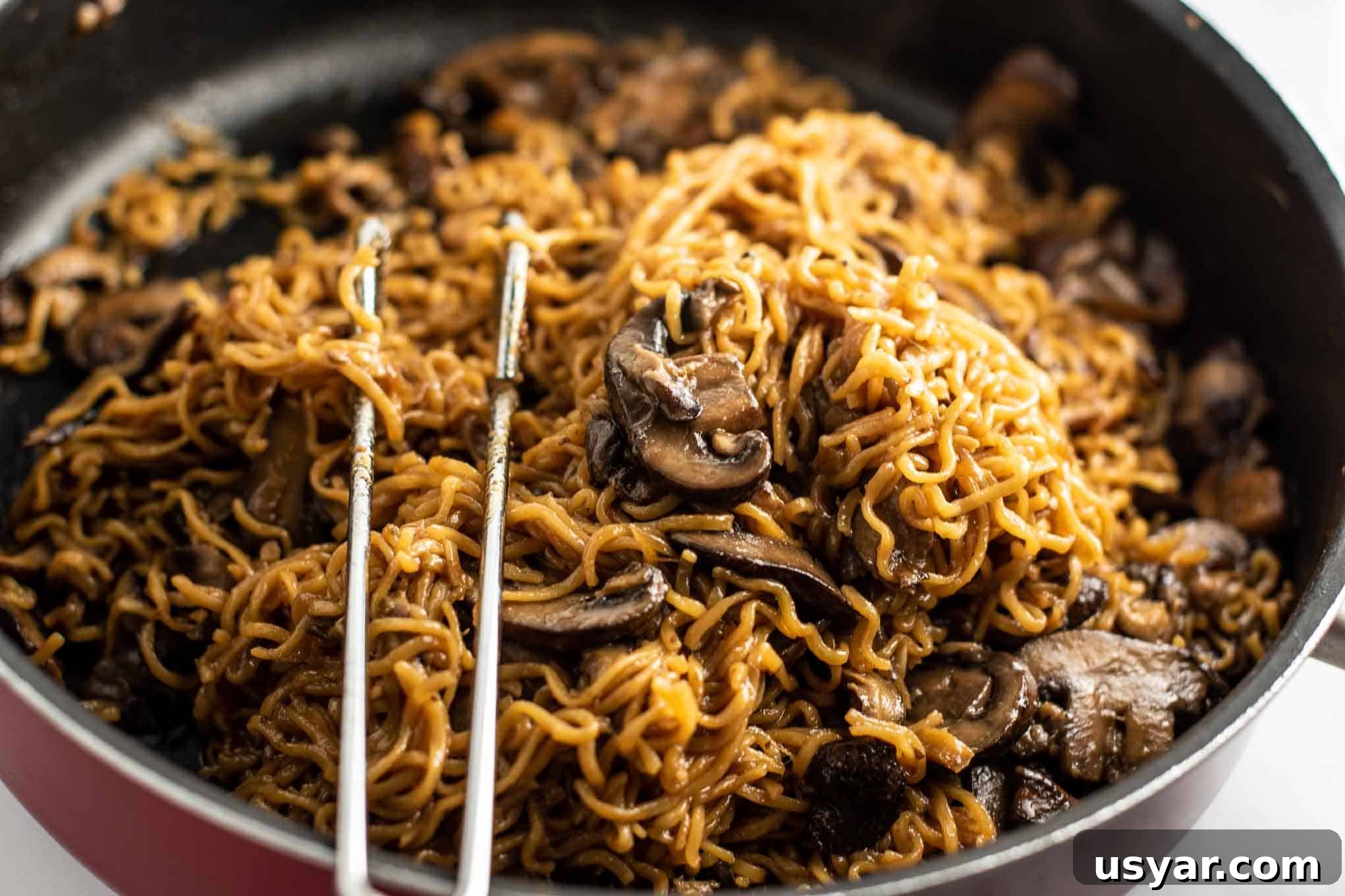 Umami Mushroom Ramen Noodles with Savory Broth 10 ramen noodles with mushrooms in a red jumbo cooker pan