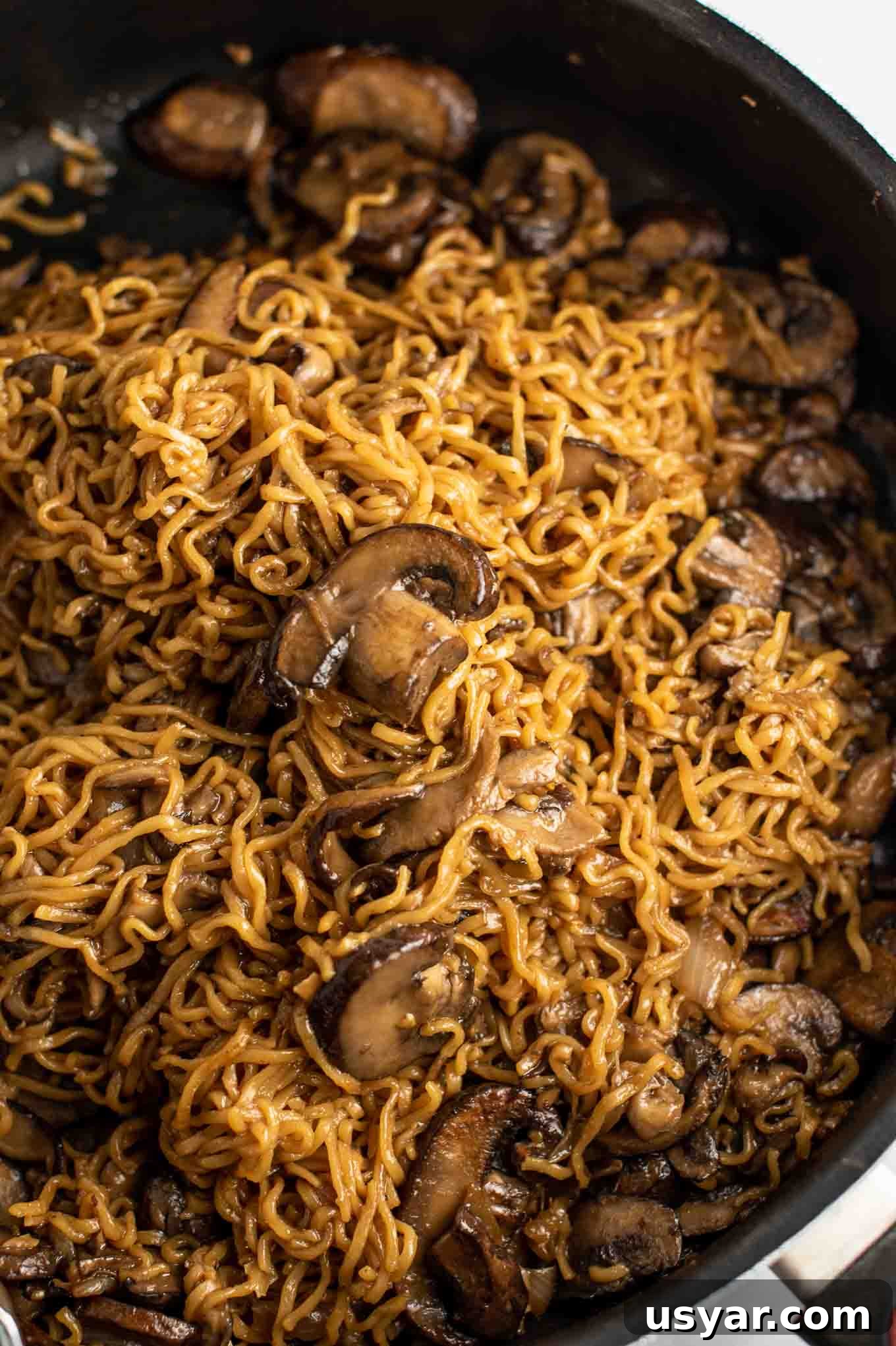 Umami Mushroom Ramen Noodles with Savory Broth 11 easy ramen stir fry with mushrooms from an overhead view in the pan
