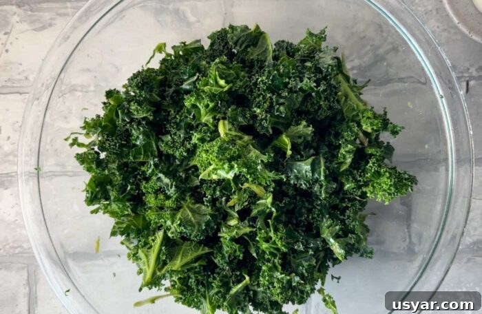 Chopped kale in a glass mixing bowl.