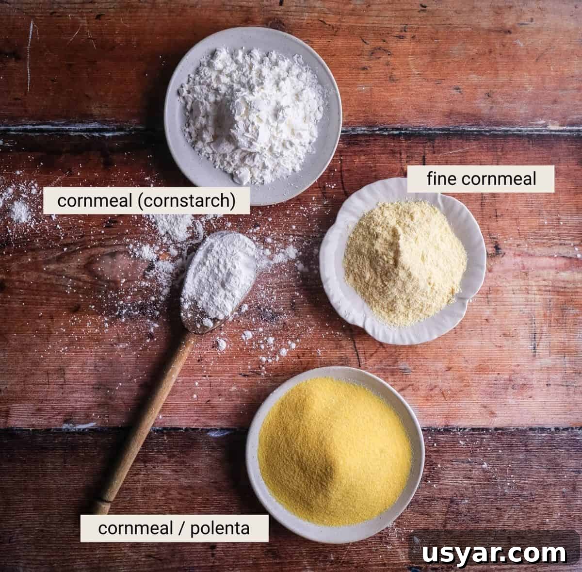 Cornflour vs Cornstarch vs Cornmeal: Key Differences & Uses 10 Cornflour, fine cornmeal and polenta on a table showing the differences between how they look.