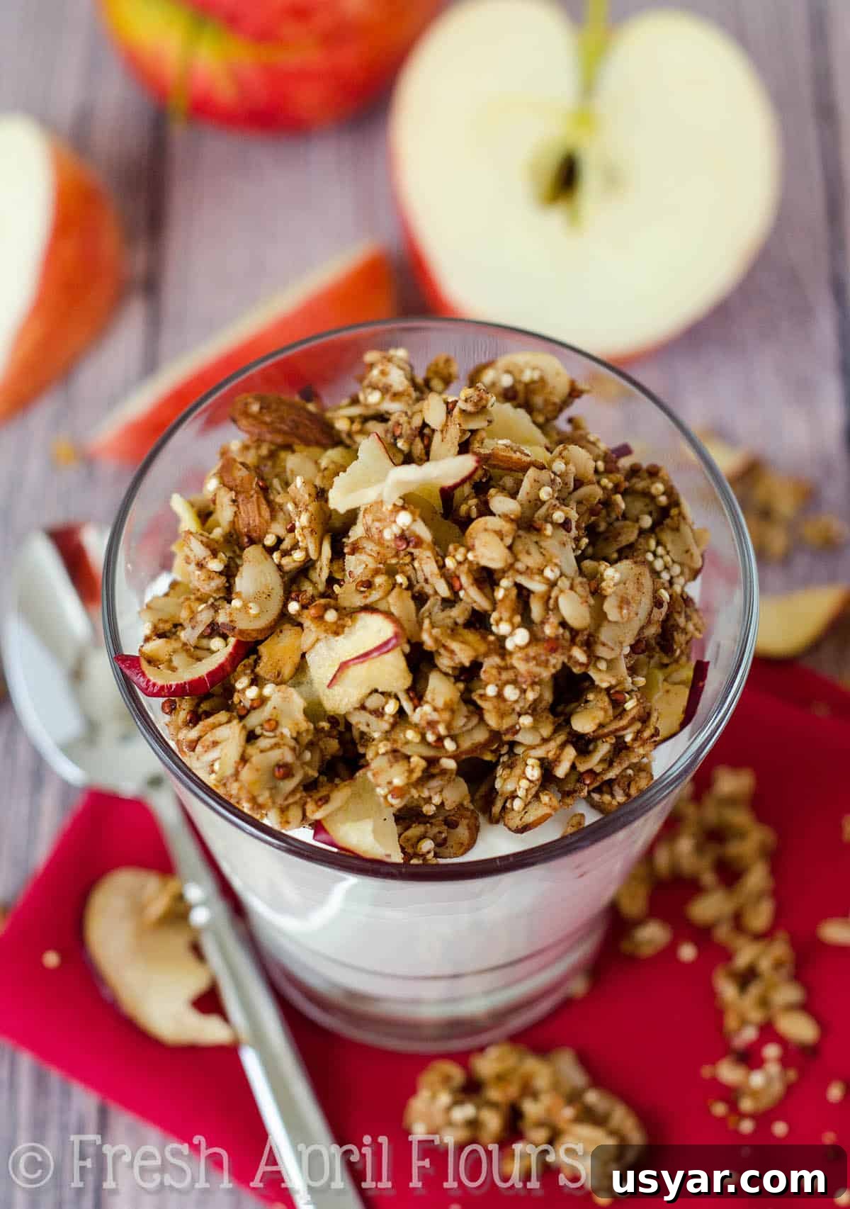 Crispy Apple Quinoa Granola Recipe 7 Apple quinoa granola on top of a cup of yogurt.