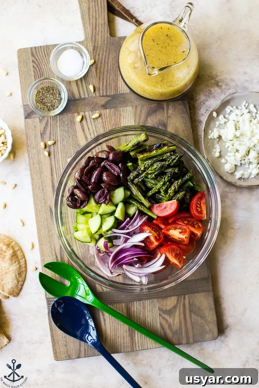 Charred Grilled Asparagus Salad with Lemon Vinaigrette 3 Overhead photo of ingredients for grilled asparagus salad in a glass bowl