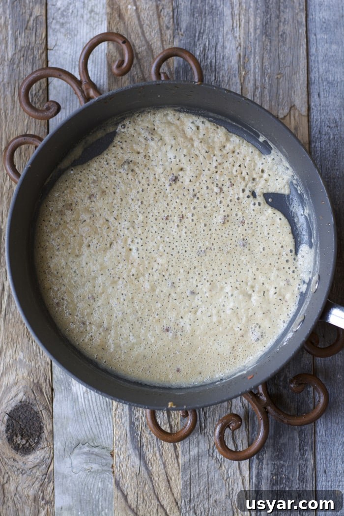 How to Make Gluten-Free Sausage Gravy 3 overhead view of saucepan with breakfast gravy in it