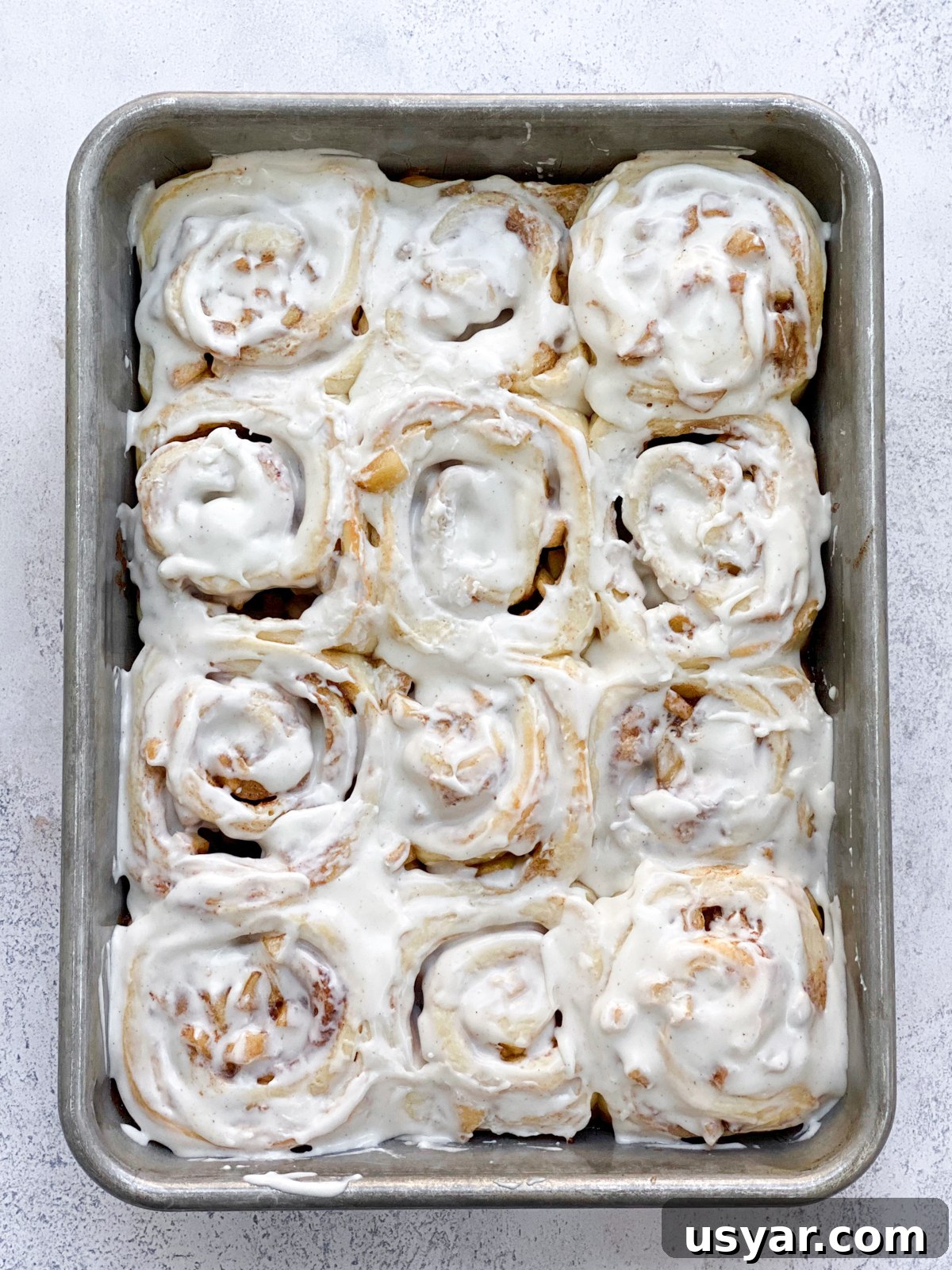 Cinnamon Rolls Stuffed with Apple Pie Filling 14 cinnamon rolls after frosted.
