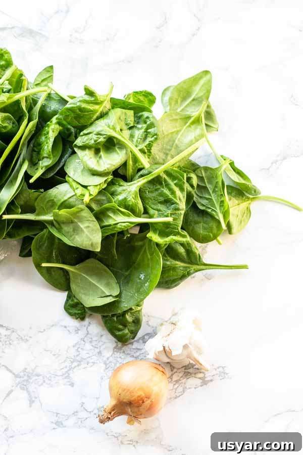 Crispy Garlic Air Fryer Spinach 4 Ingredients for making fresh spinach in an Air Fryer.