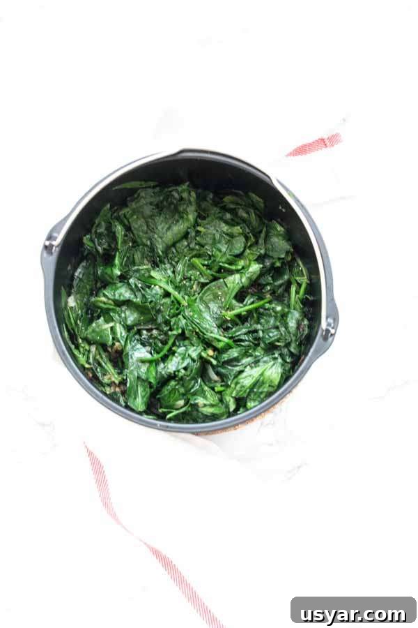 Crispy Garlic Air Fryer Spinach 8 Close up of spinach prepared in an Air Fryer.