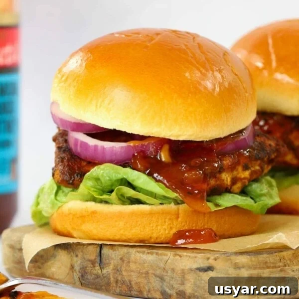 Homemade Chicken Tikka Burger on a serving board, ready to eat.
