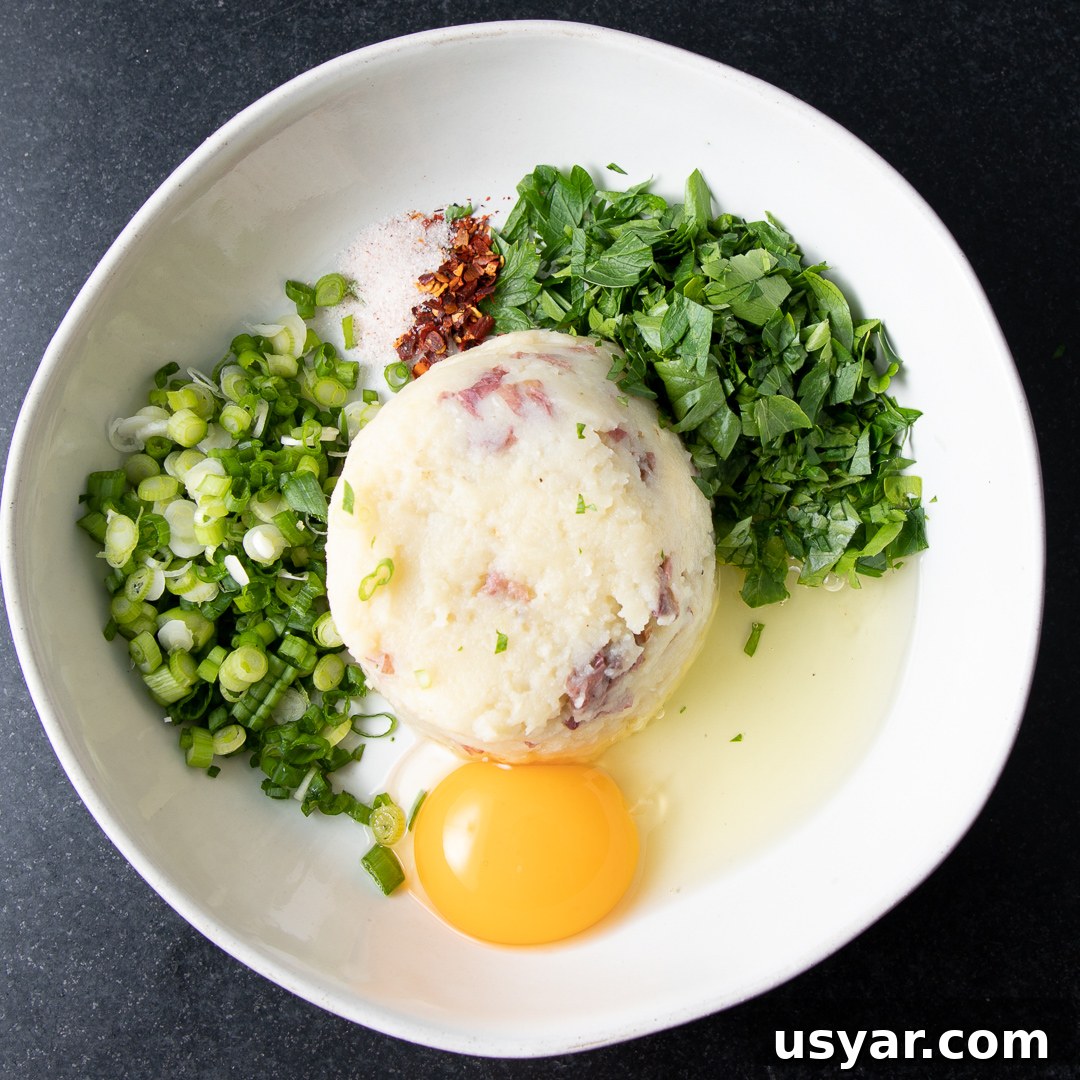 Crispy Leftover Mashed Potato Waffles 4 Egg, mashed potatoes and root vegetables, scallions and chopped parsley.