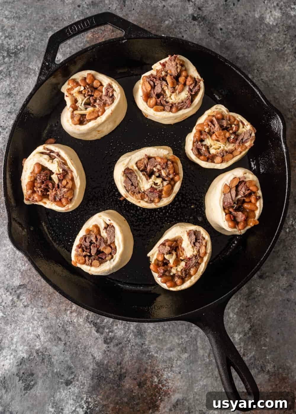 cut side down of beef rolls in skillet